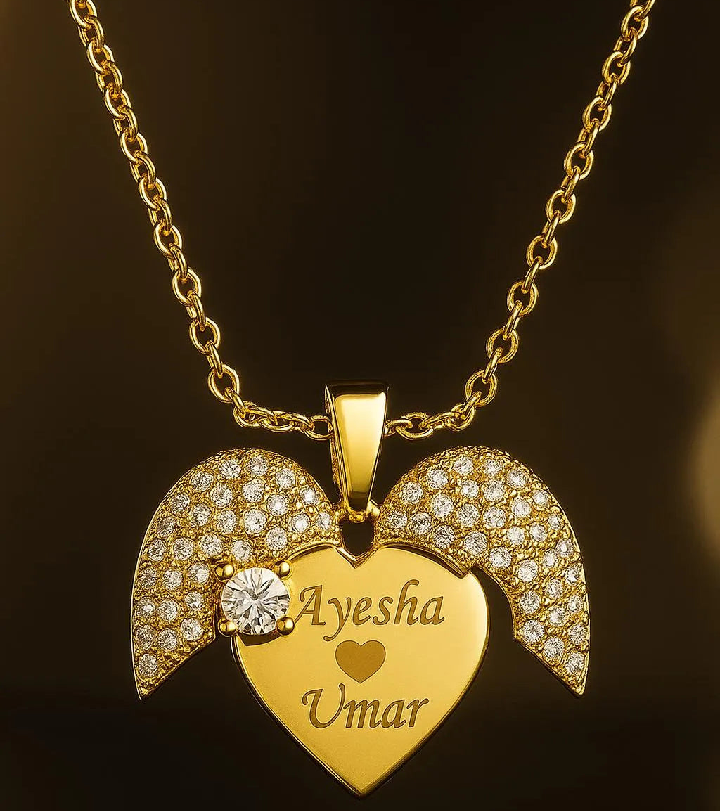 Gold necklace with a heart-shaped pendant and engraved names on a dark background